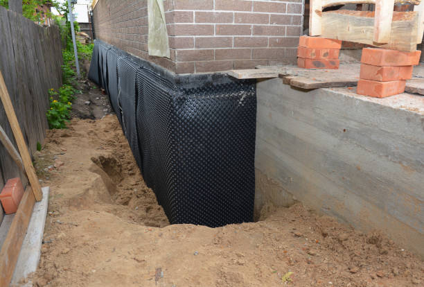 Happy homeowners after waterproofing job in Citronelle